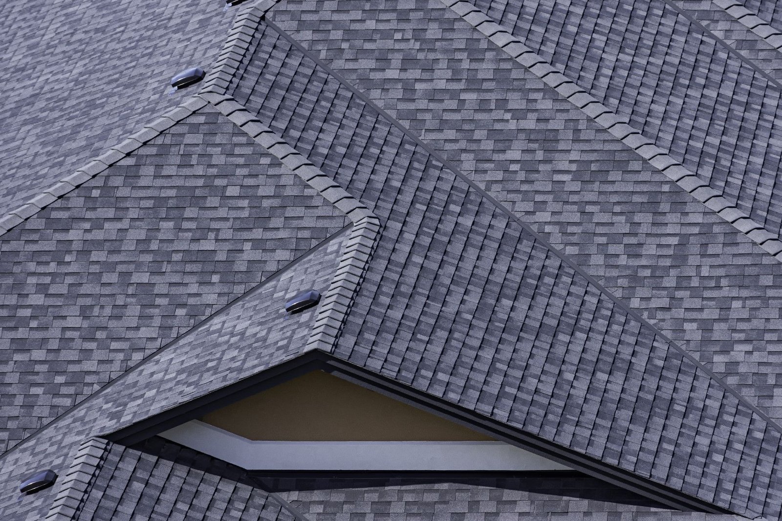Asphalt shingles installed on a modern sloped roof