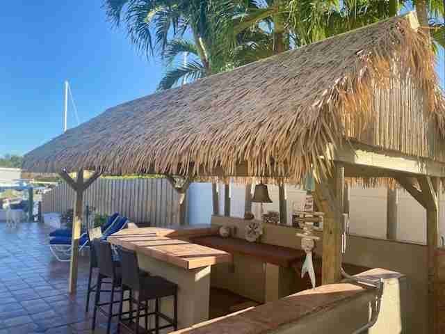 Synthetic thatch supplied in rolls
